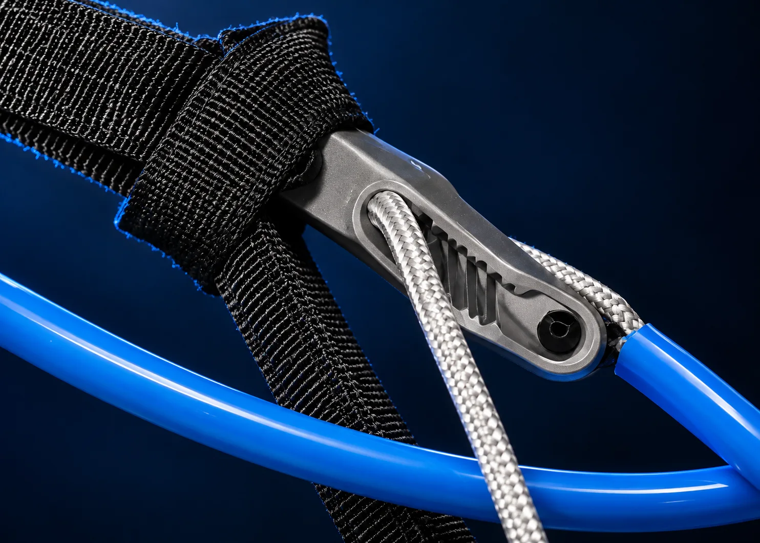 Close-up of webbing, adjustment rope and blue harness line tubing